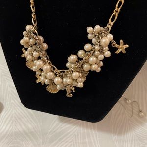Rare/ Unique faux pearls and gold tone charms.  16.5” chocker